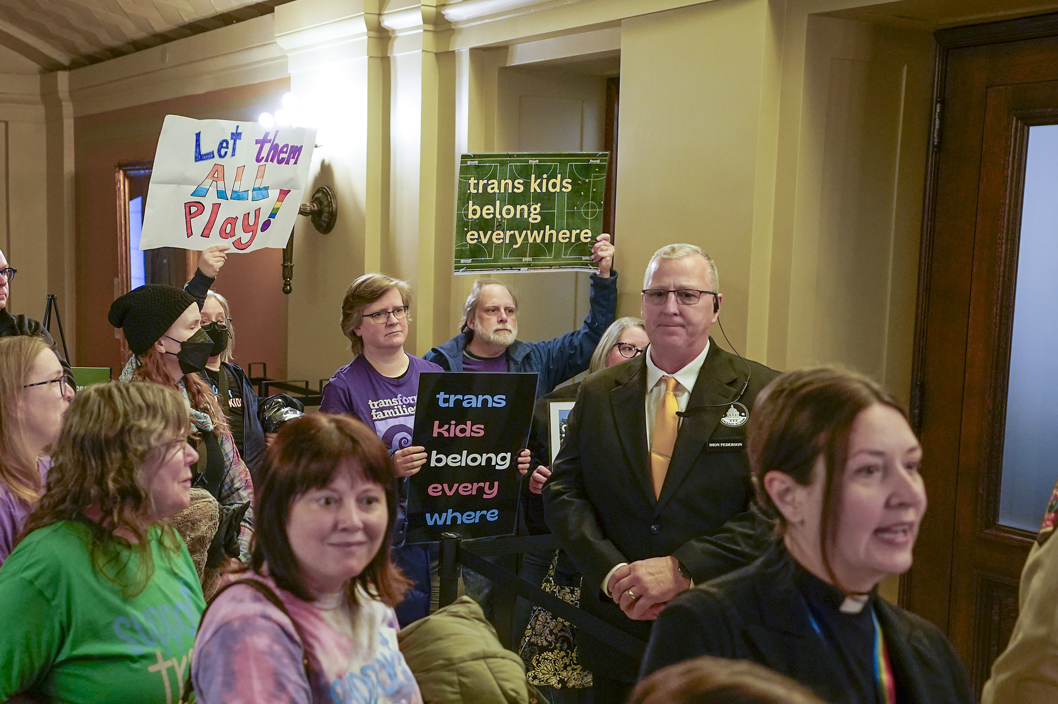 A crowd forms outside a Capitol hearing room Feb. 19 ahead of a House Education Policy Committee hearing on HF12, a bill to restrict female sports team participation to biological females. (Photo by Michele Jokinen)  